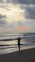 Families enjoy sunset beach time in North Kuta, Indonesia