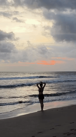 Families enjoy sunset beach time in North Kuta, Indonesia