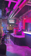 DJ performs at Novosibirsk club with pink lighting