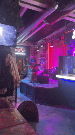 DJ performs at Novosibirsk club with pink lighting