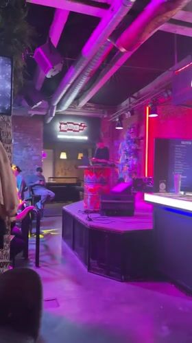 DJ performs at Novosibirsk club with pink lighting