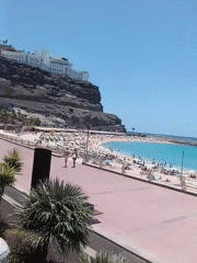 Busy beach day observed in Mogán, Spain