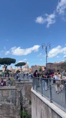 Tourist documents Roman Forum views on sunny May morning