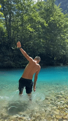 Swimming and wading in turquoise river waters in Vusanje