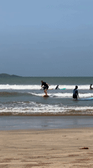 Surf lessons and wave riding at Weligama beach