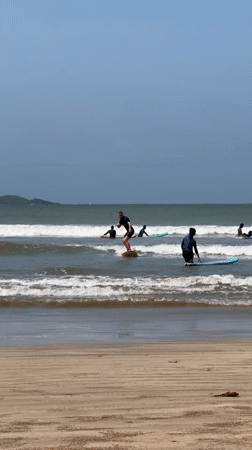 Surf lessons and wave riding at Weligama beach