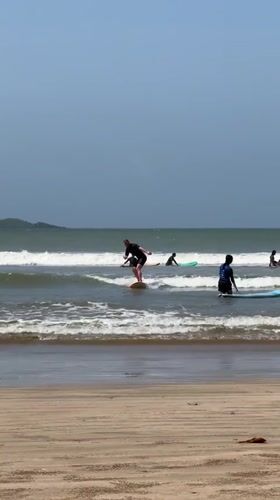Surf lessons and wave riding at Weligama beach