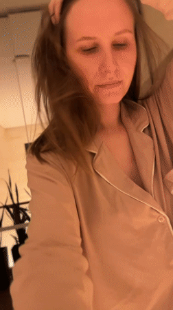 Woman documents evening at home with pet bulldog in Gelendzhik