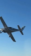 Propeller plane N279EL cruising through clear skies over Santa Ynez