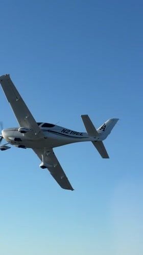 Propeller plane N279EL cruising through clear skies over Santa Ynez