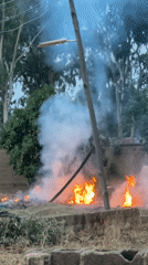Grass fire produces heavy smoke near Kirana, Nigeria