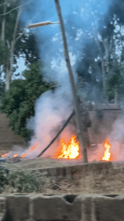 Grass fire produces heavy smoke near Kirana, Nigeria