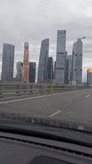 Driver records Moscow skyline from highway