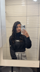 Woman Takes Mirror Selfies in Gabrovo Bathroom