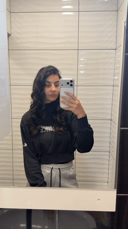 Woman Takes Mirror Selfies in Gabrovo Bathroom