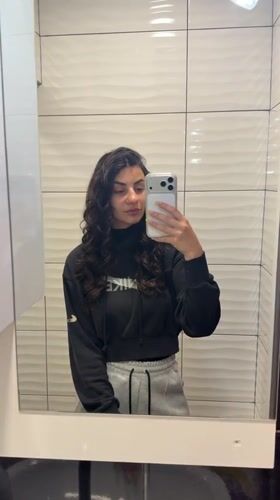 Woman Takes Mirror Selfies in Gabrovo Bathroom