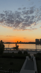 Kazan evening scenes: sunset skyline and Tesla near Ferris wheel