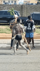 Political procession with traditional performers marches through Akwanga, Nigeria