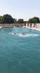 Men and boys enjoy morning swim at Samundri pool