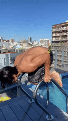 Man performs pool acrobatics at Buenos Aires rooftop gathering
