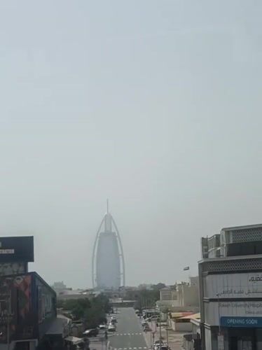 Commuter documents Dubai metro journey through urban cityscape