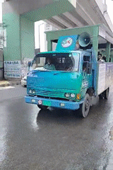 Modified truck spotted on wet Dhaka street under overpass