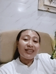 Woman smiles for portrait photo in Denpasar, Indonesia