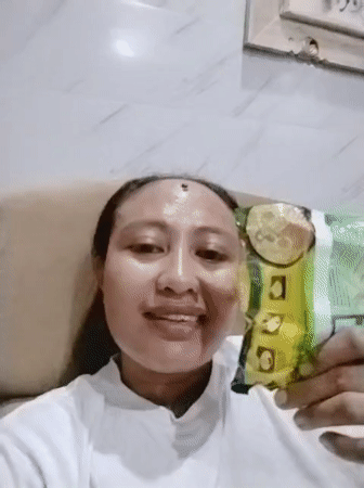 Woman smiles for portrait photo in Denpasar, Indonesia