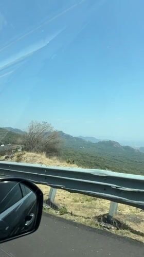 Driver captures sunny mountain drive through Coajomulco, Mexico