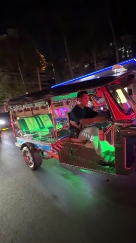 Modified tuk-tuk with LED lighting spotted operating in Bangkok