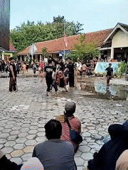 Indonesian village life: children playing, traditional dance performance documented