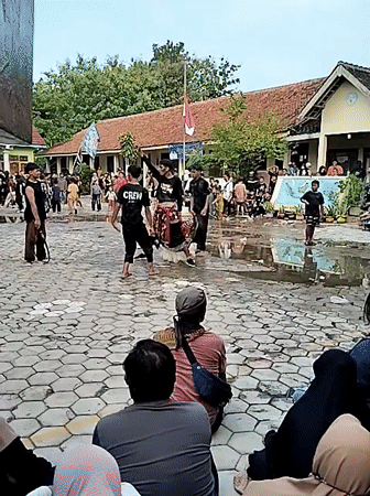 Indonesian village life: children playing, traditional dance performance documented