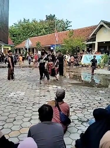 Indonesian village life: children playing, traditional dance performance documented