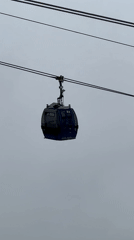 Cable cars operate through cloudy skies in Fethiye, Turkey