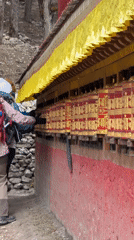 Hikers spin prayer wheels, trek through Khumjung village Nepal