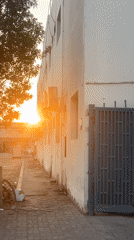 Golden sunset settles over Musaffah streets at dusk