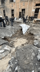 Repair crews work on damaged infrastructure at Kyiv building