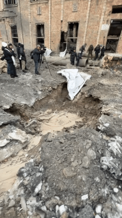 Repair crews work on damaged infrastructure at Kyiv building