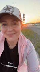 Woman observed during dramatic sunset in Chaikovsky, Russia
