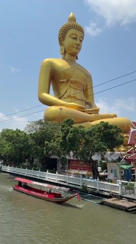 Golden Buddha statues photographed in Bangkok at dawn