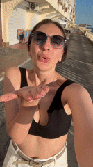 Woman films seaside selfies in Sochi as baby sleeps nearby
