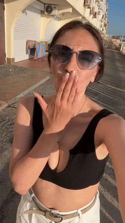Woman films seaside selfies in Sochi as baby sleeps nearby