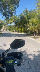 Motorcycle ride through tropical Playa del Carmen streets