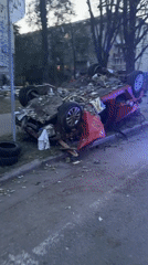 Explosion aftermath leaves vehicles and building damaged in Kyiv