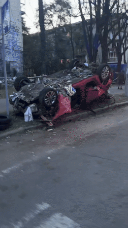 Explosion aftermath leaves vehicles and building damaged in Kyiv