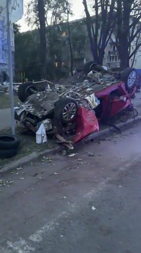 Explosion aftermath leaves vehicles and building damaged in Kyiv