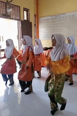 Young girls perform traditional dance in Indonesian classroom