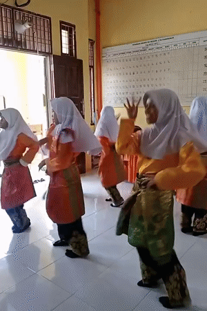 Young girls perform traditional dance in Indonesian classroom