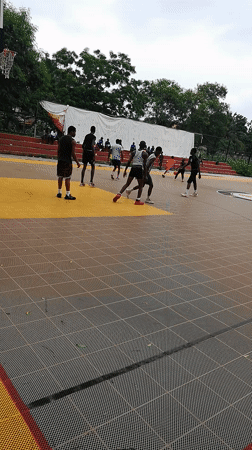 Afternoon basketball game on outdoor court in Lagos