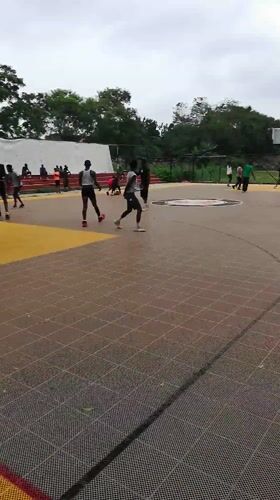 Afternoon basketball game on outdoor court in Lagos